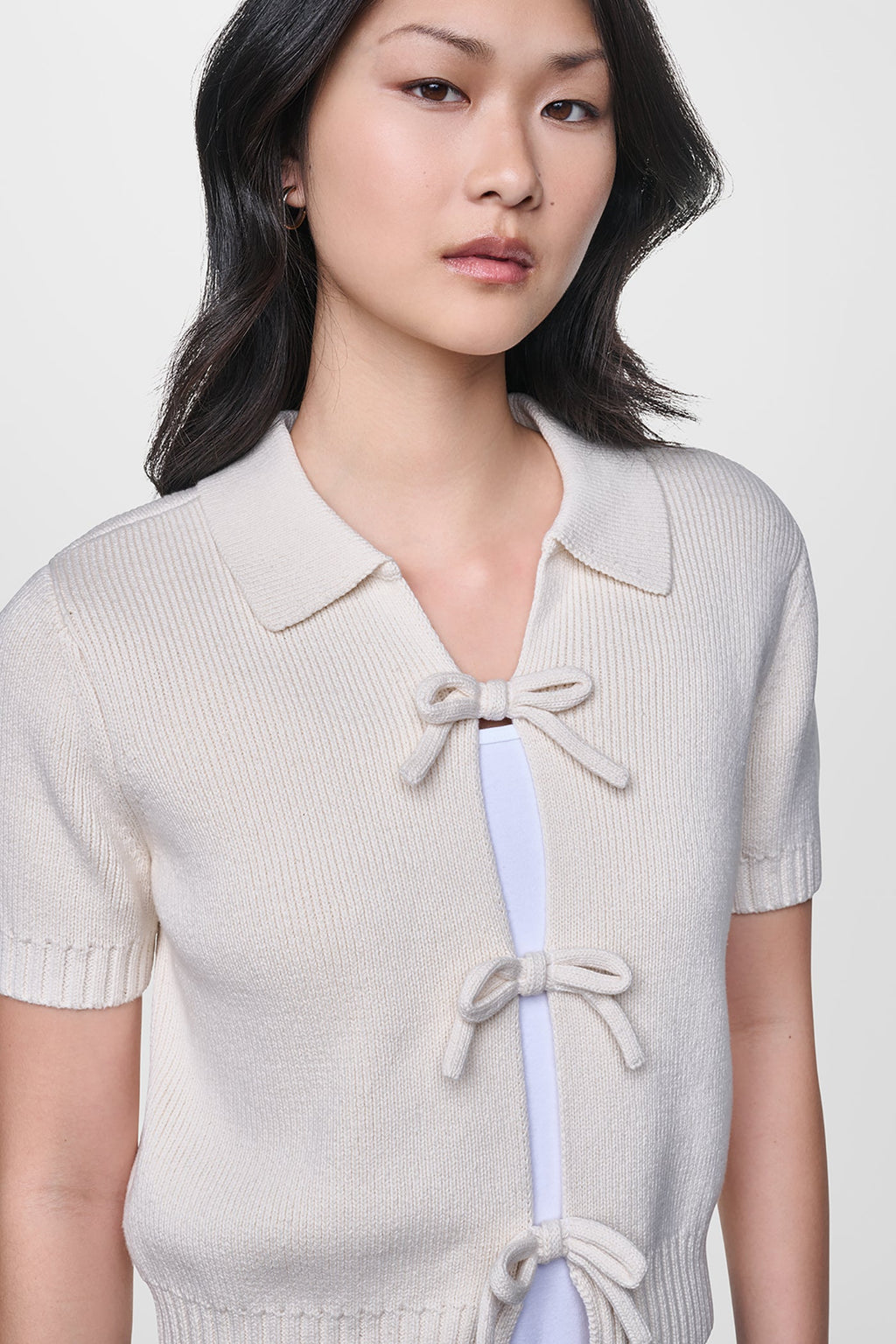 SHORT SLEEVE TIE FRONT POLO SWEATER